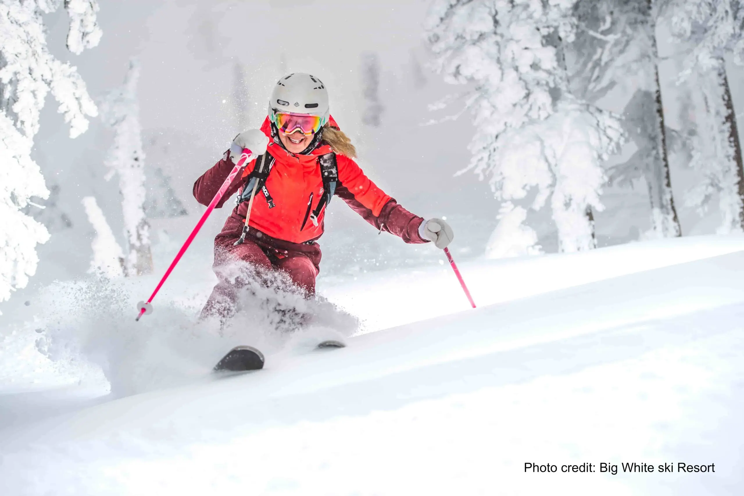woman skiing deep powder at Big White Ski Resort