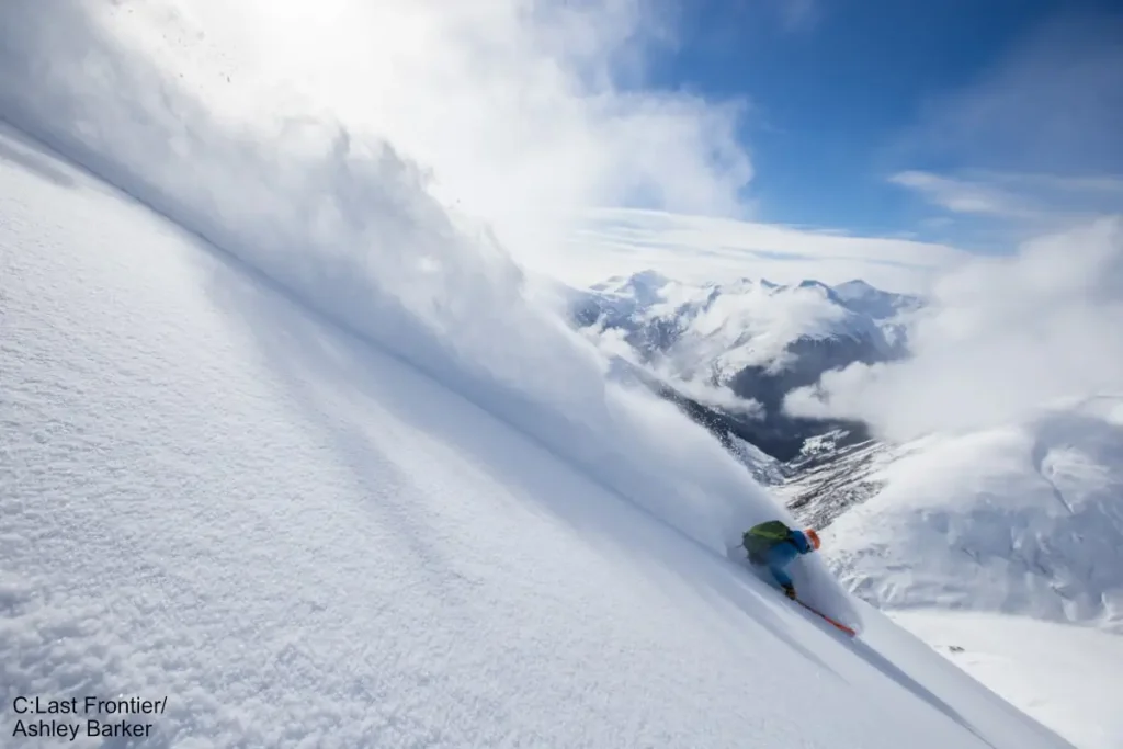 skier in deep powder at Last Frontier heli skiing area