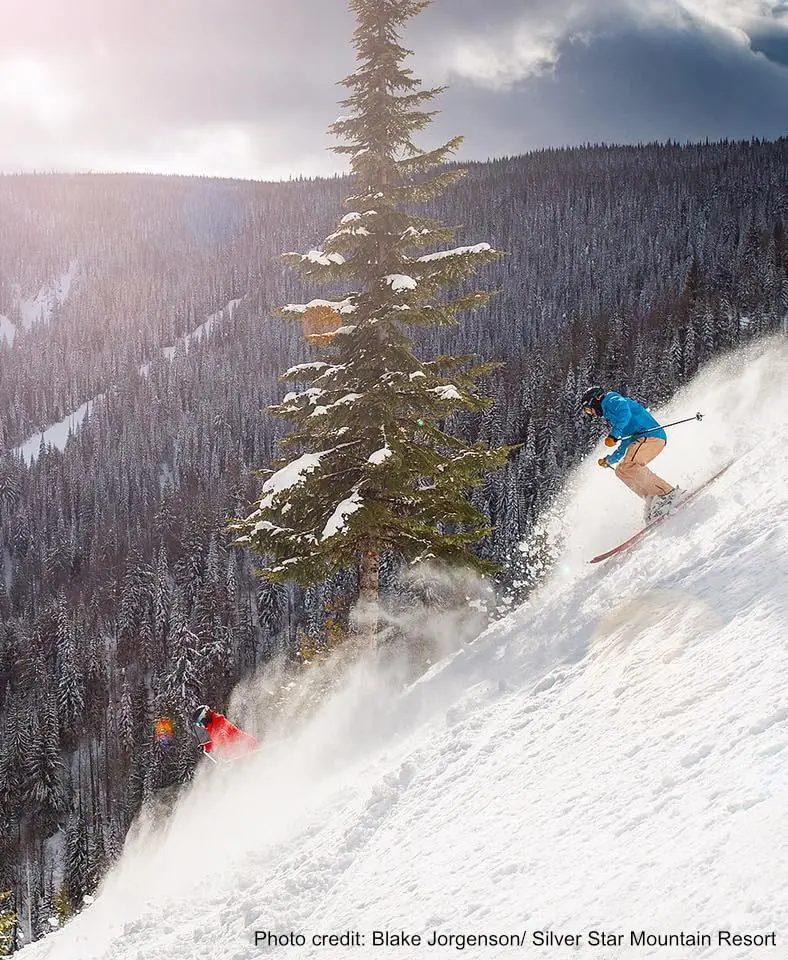 two skiers on a steep run at Silver Star resort