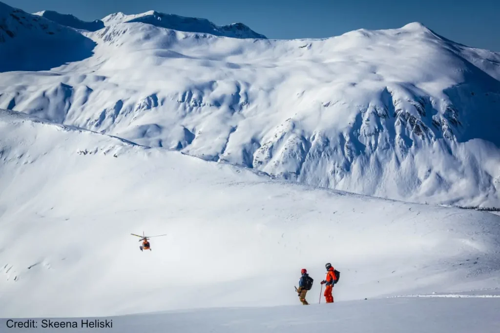 helicopter coming in to pick up skiers at Skeena Bearclaw