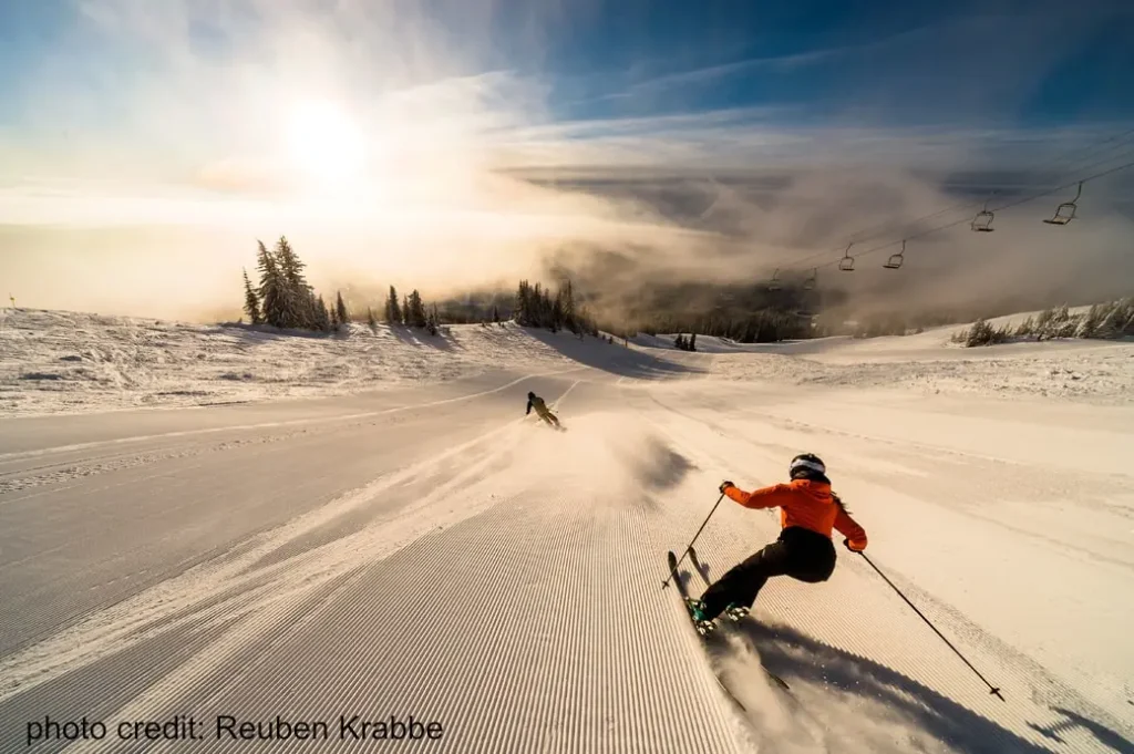 skier on a groomed run at Sun Peaks ski resort