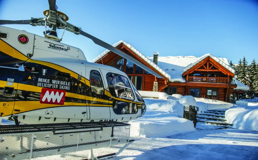 Mike Wiegele helicopter on the ground at ski lodge