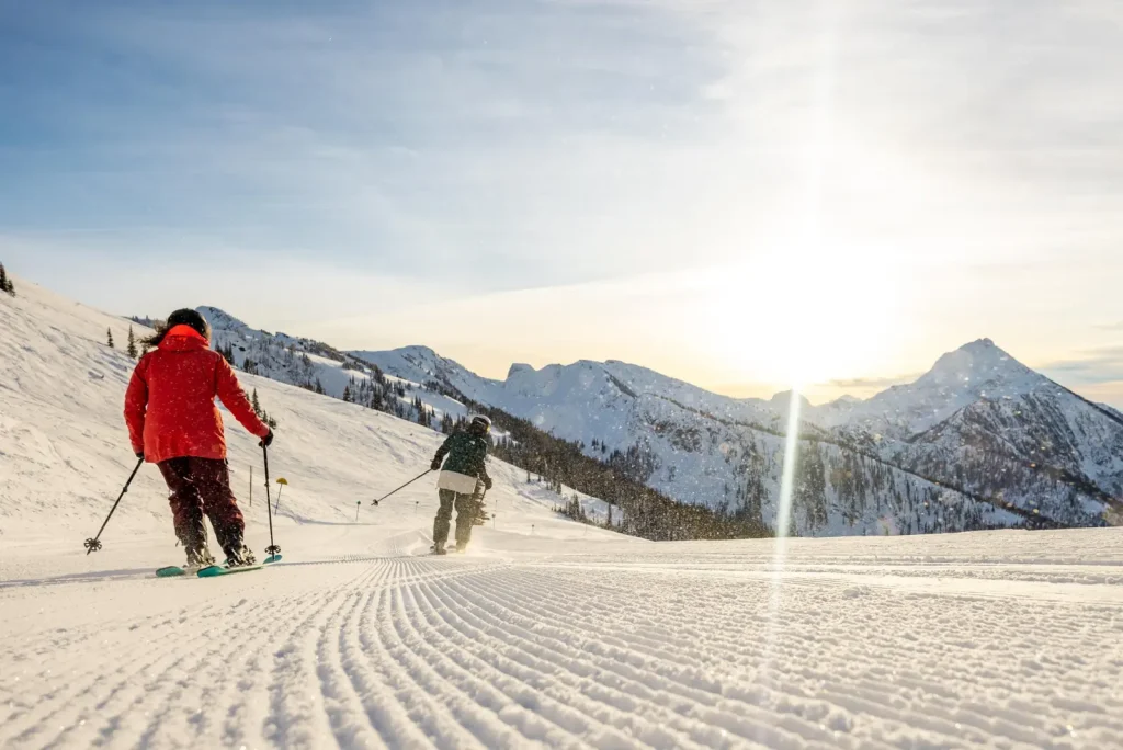 skiers on a groomed run in Revelstoke