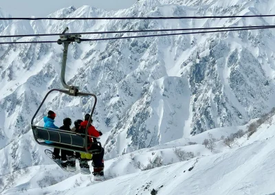 skiers on the lift in Hakuba